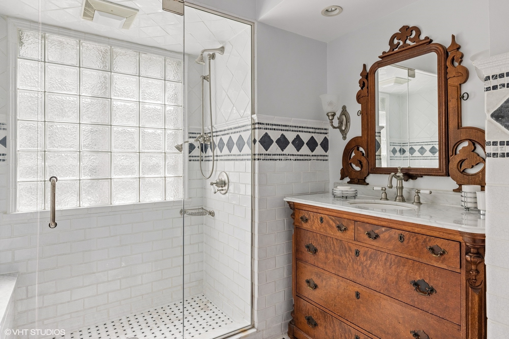 474 Ash Street Winnetka, IL 60093 - Photo 31 of 57 a bathroom with a granite countertop sink a mirror and shower