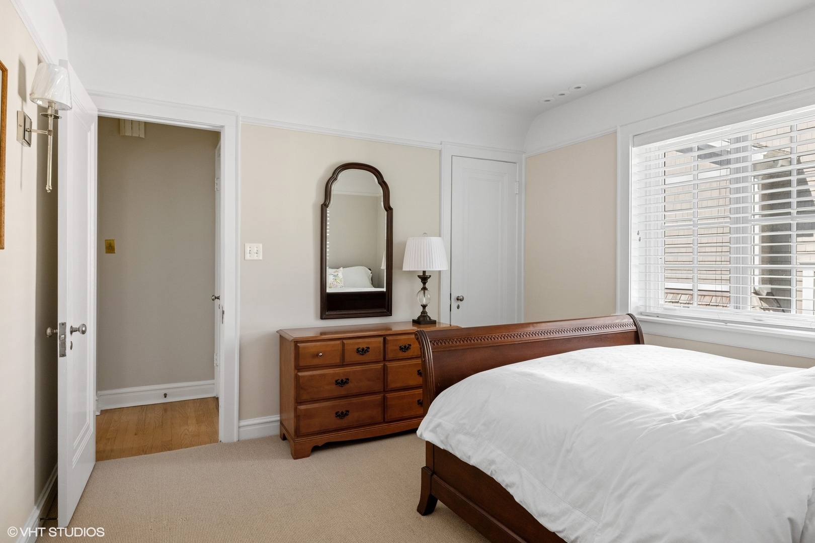 474 Ash Street Winnetka, IL 60093 - Photo 33 of 57 a spacious bedroom with a bed and a window