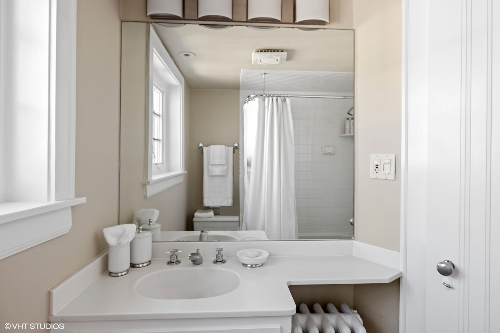 474 Ash Street Winnetka, IL 60093 - Photo 39 of 57 a bathroom with a sink and a mirror