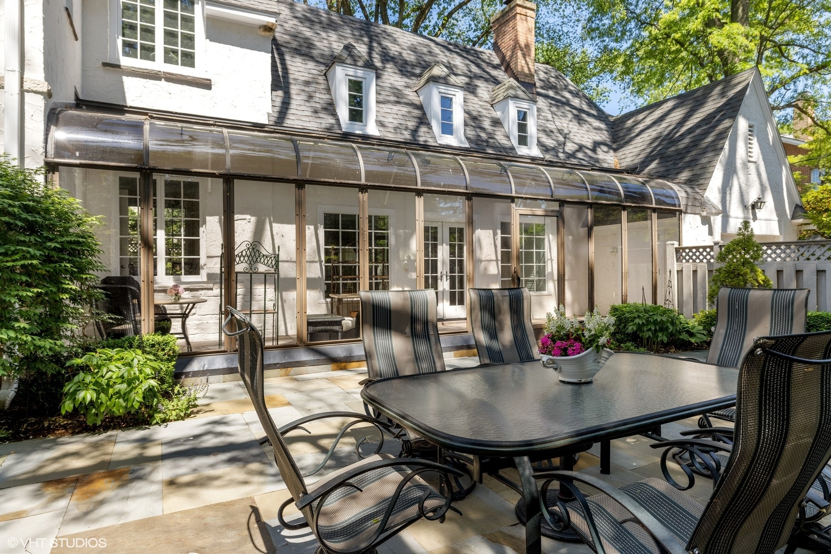 474 Ash Street Winnetka, IL 60093 - Photo 46 of 57 a view of a house with backyard and sitting area