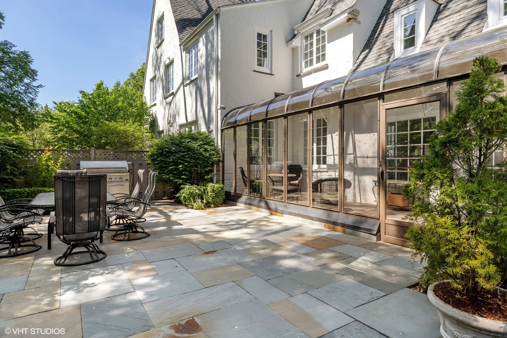 474 Ash Street Winnetka, IL 60093 - Photo 48 of 57 a view of a chair and tables in the patio of the house