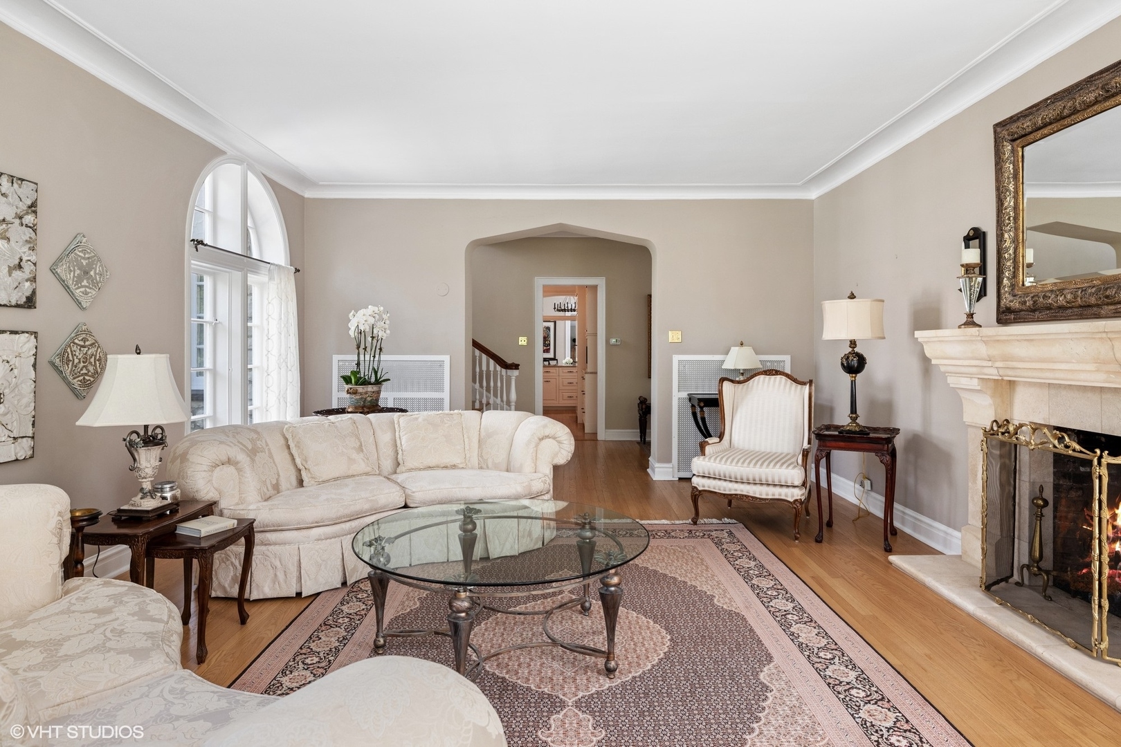 474 Ash Street Winnetka, IL 60093 - Photo 6 of 57 a living room with furniture a fireplace and a table