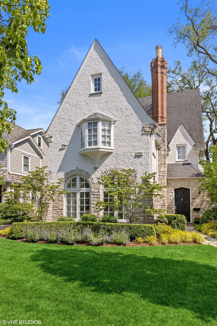 474 Ash Street Winnetka, IL 60093 - Photo 52 of 57 a front view of a house with a garden