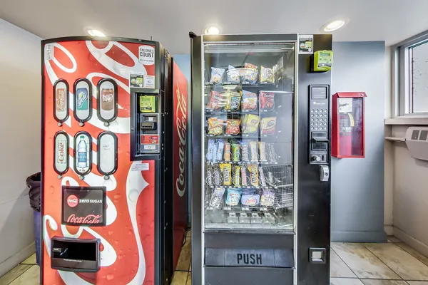 a bunch of street signs outside the stores