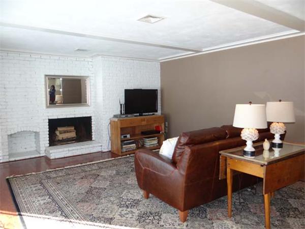 7 Burton Farm Drive Andover, MA 01810 - Photo 12 of 20 a living room with furniture a flat screen tv and a fireplace