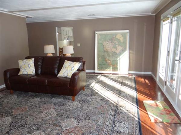 7 Burton Farm Drive Andover, MA 01810 - Photo 13 of 20 a living room with furniture and a large window