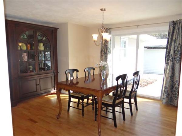 7 Burton Farm Drive Andover, MA 01810 - Photo 3 of 20 a view of a dining room with furniture window and wooden floor