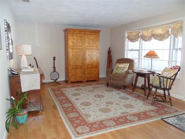 7 Burton Farm Drive Andover, MA 01810 - Photo 7 of 20 a living room with furniture and a wooden floor