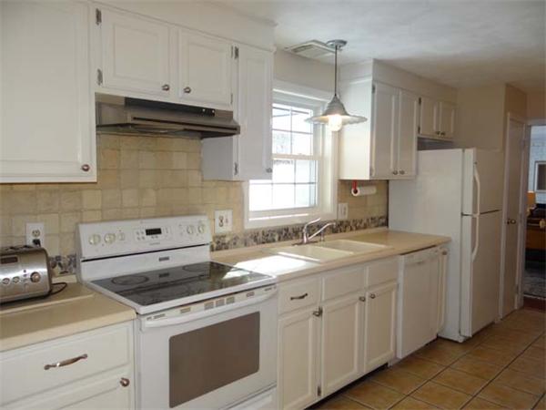 7 Burton Farm Drive Andover, MA 01810 - Photo 9 of 20 a kitchen with a sink stove and refrigerator