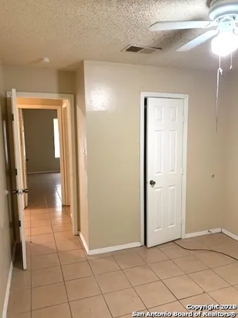 a white toilet sitting next to a bath tub