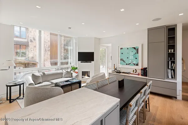 a living room with furniture window and wooden floor