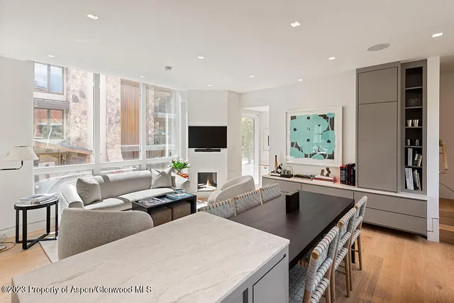 a living room with furniture window and wooden floor
