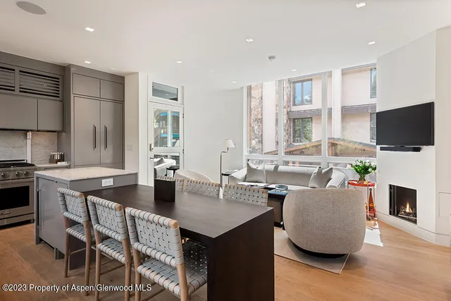 a living room with fireplace furniture and a flat screen tv