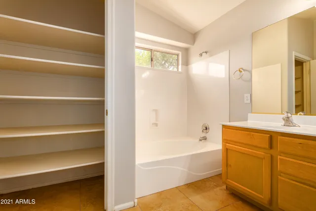 a bathroom with a bathtub and a sink