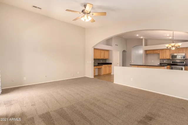 a view of a kitchen with a sink and a kitchen counter top