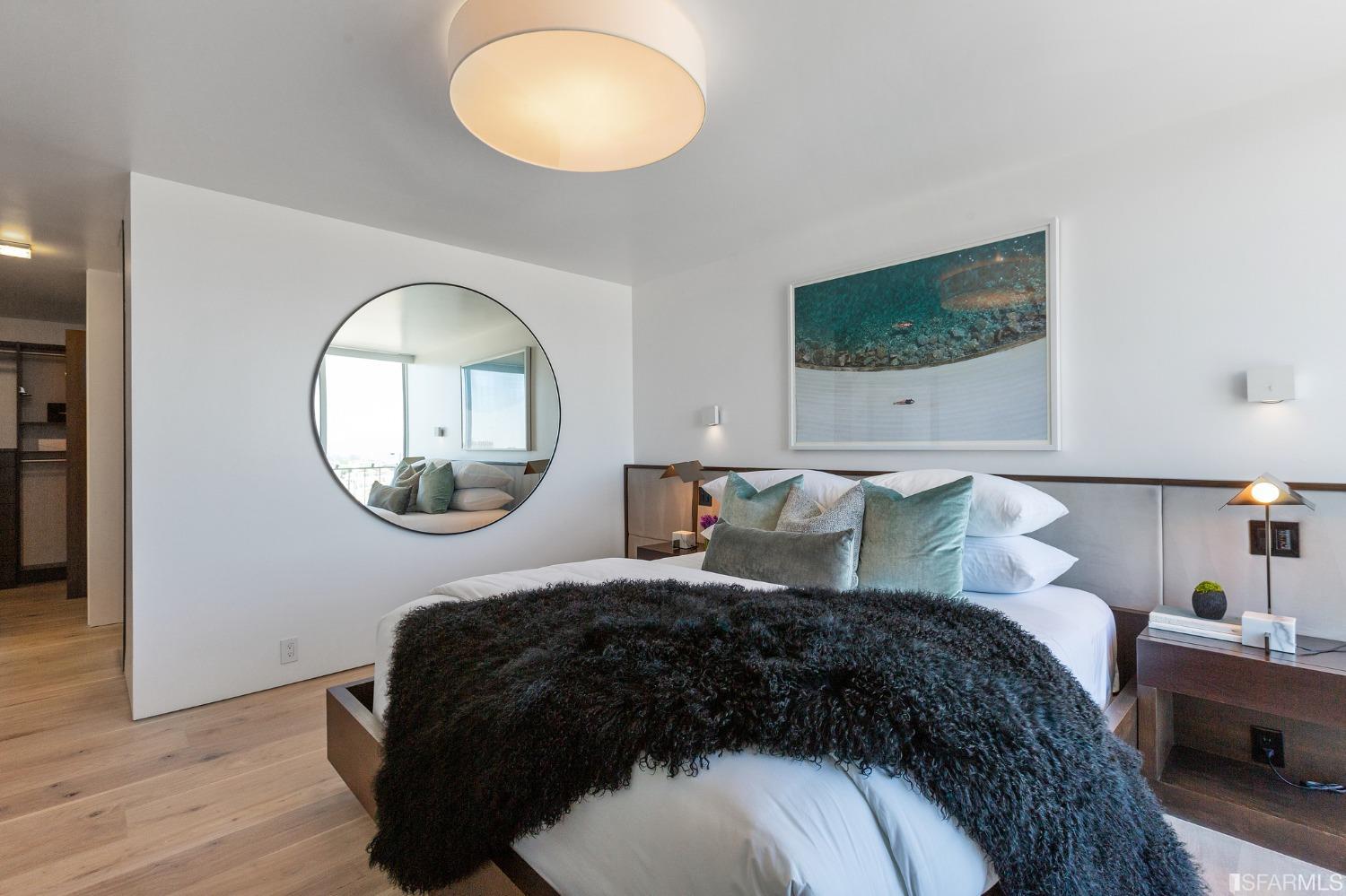 1835 Franklin Street, Unit 1601 San Francisco, CA 94109 - Photo 25 of 37 a bedroom with a bed and a mirror