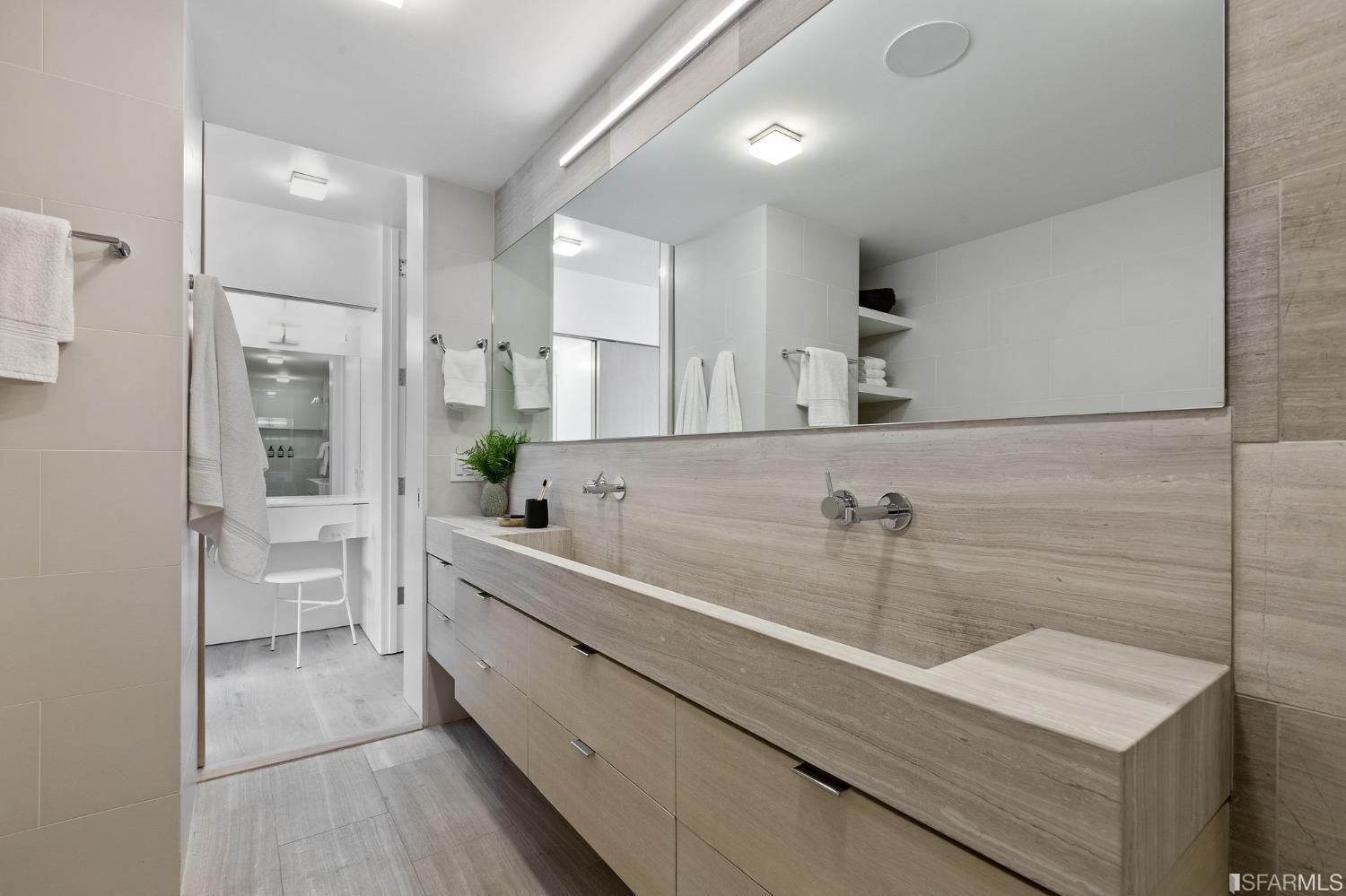 1835 Franklin Street, Unit 1601 San Francisco, CA 94109 - Photo 27 of 37 a view of a kitchen with a sink stainless steel appliances and cabinets