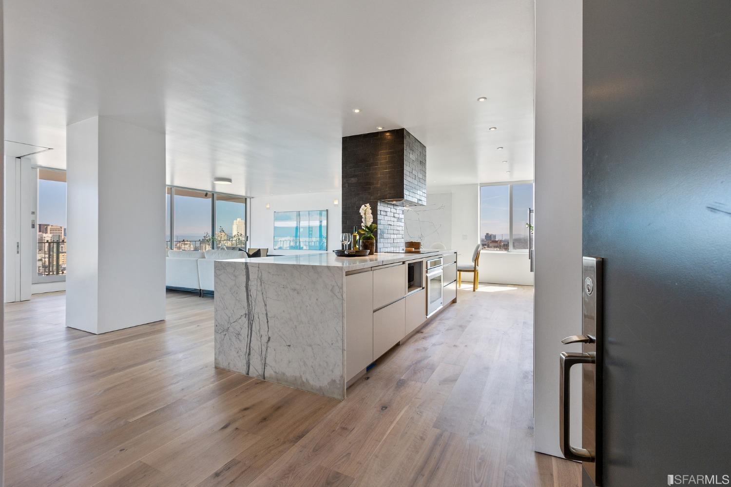 1835 Franklin Street, Unit 1601 San Francisco, CA 94109 - Photo 3 of 37 a living room with furniture and a wooden floor