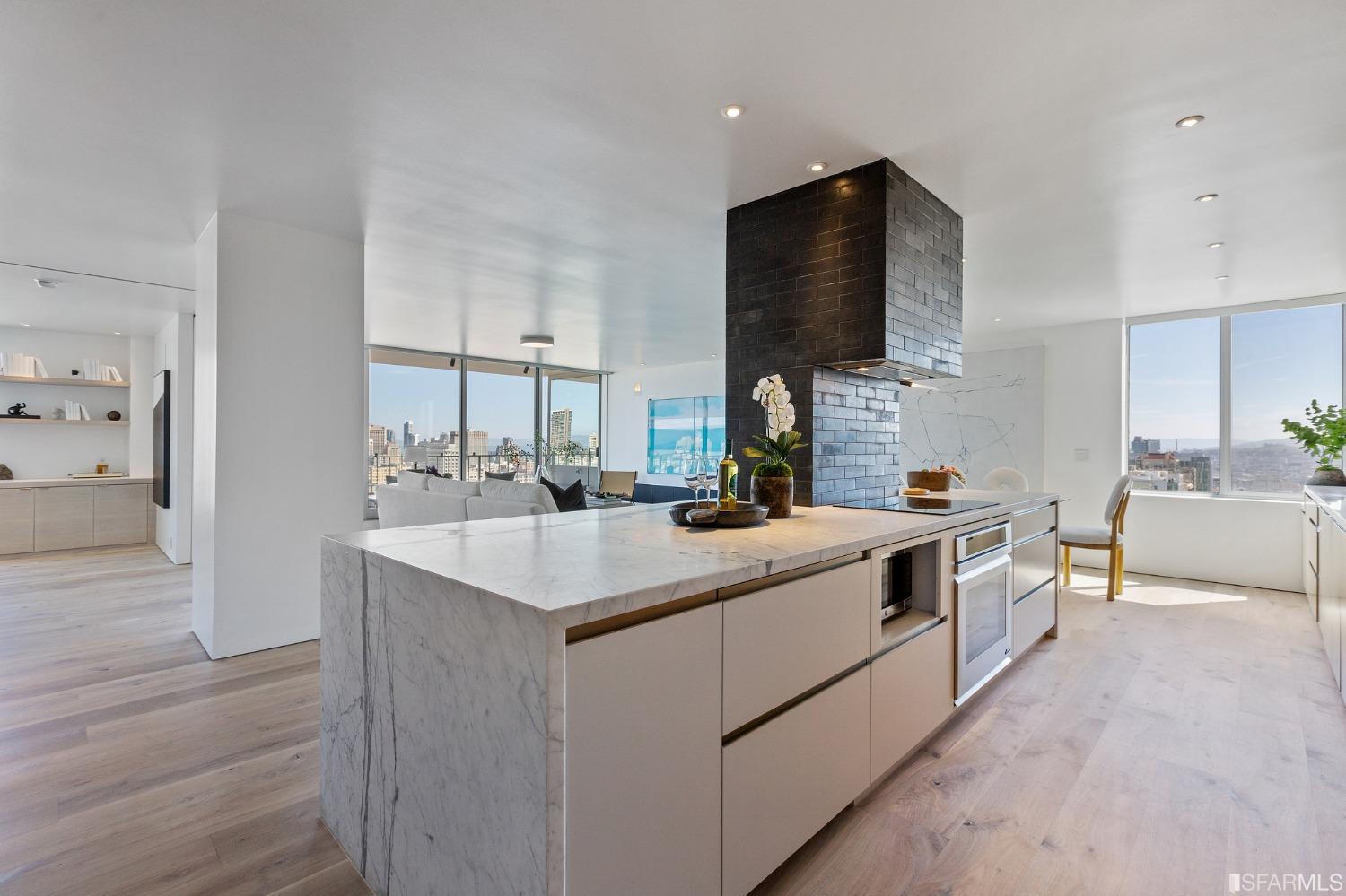 1835 Franklin Street, Unit 1601 San Francisco, CA 94109 - Photo 4 of 37 a kitchen with a sink and a stove top oven with wooden floor