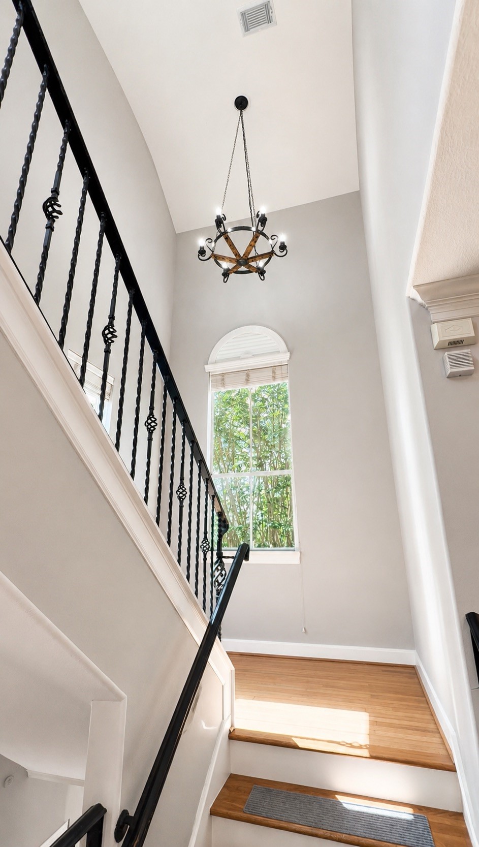 4502 Rose Street Houston, TX 77007 - Photo 28 of 40 Custom chandeiler in stairway headed to third floor