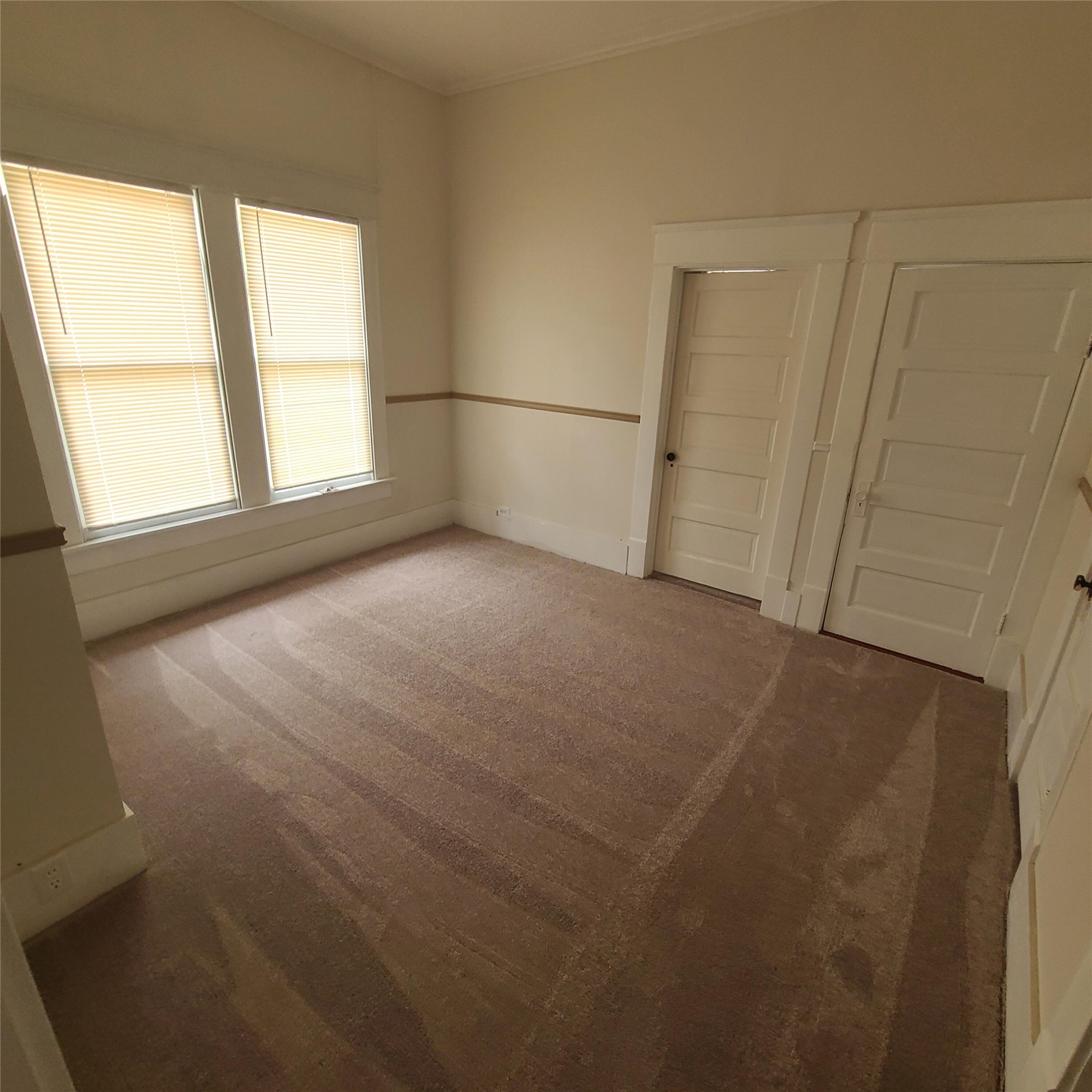 615 East Washington Street Giddings, TX 78942 - Photo 16 of 22 a view of empty room with windows