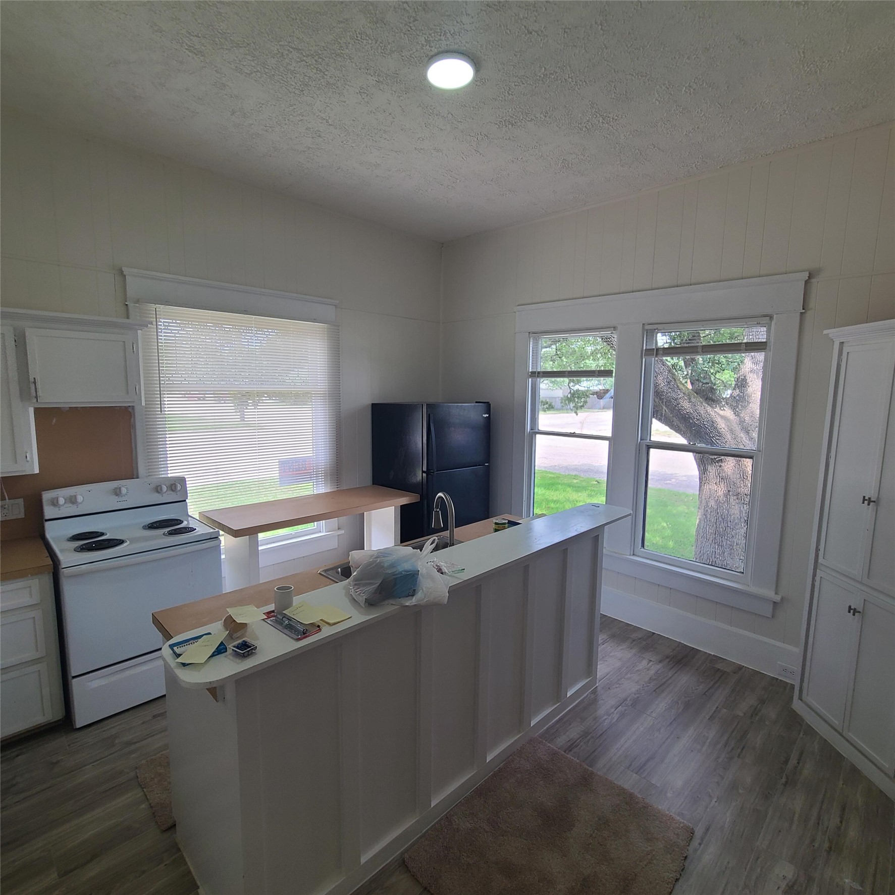 615 East Washington Street Giddings, TX 78942 - Photo 18 of 22 a kitchen with a stove and a refrigerator