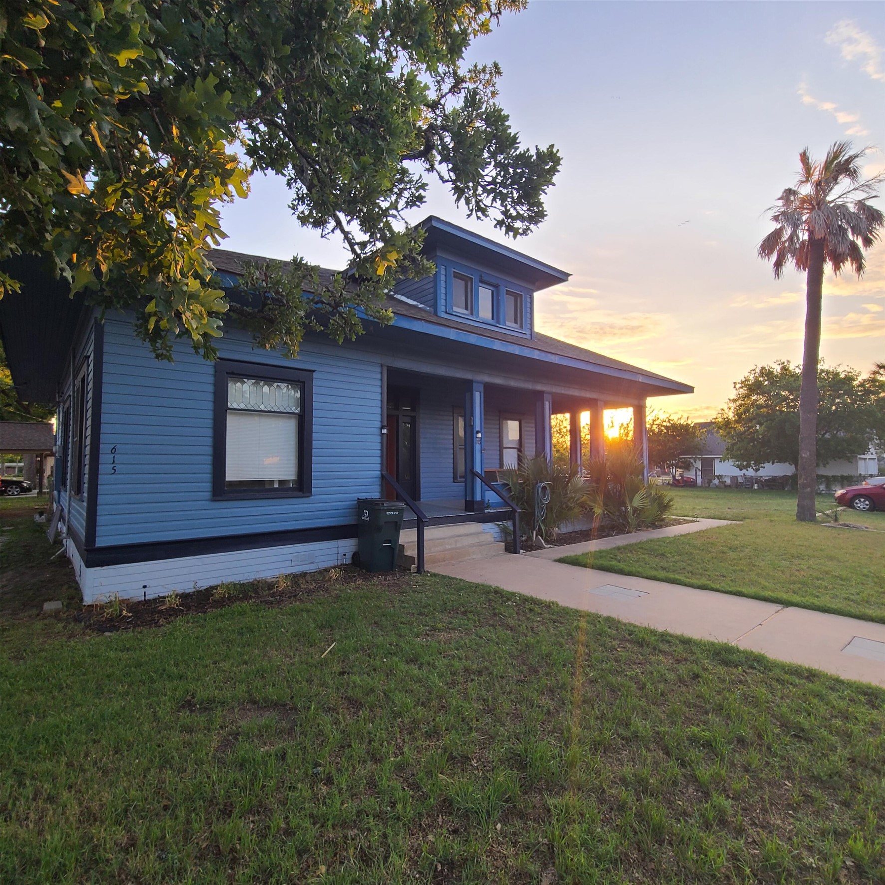 615 East Washington Street Giddings, TX 78942 - Photo 2 of 22 a view of a house with a yard and tree s