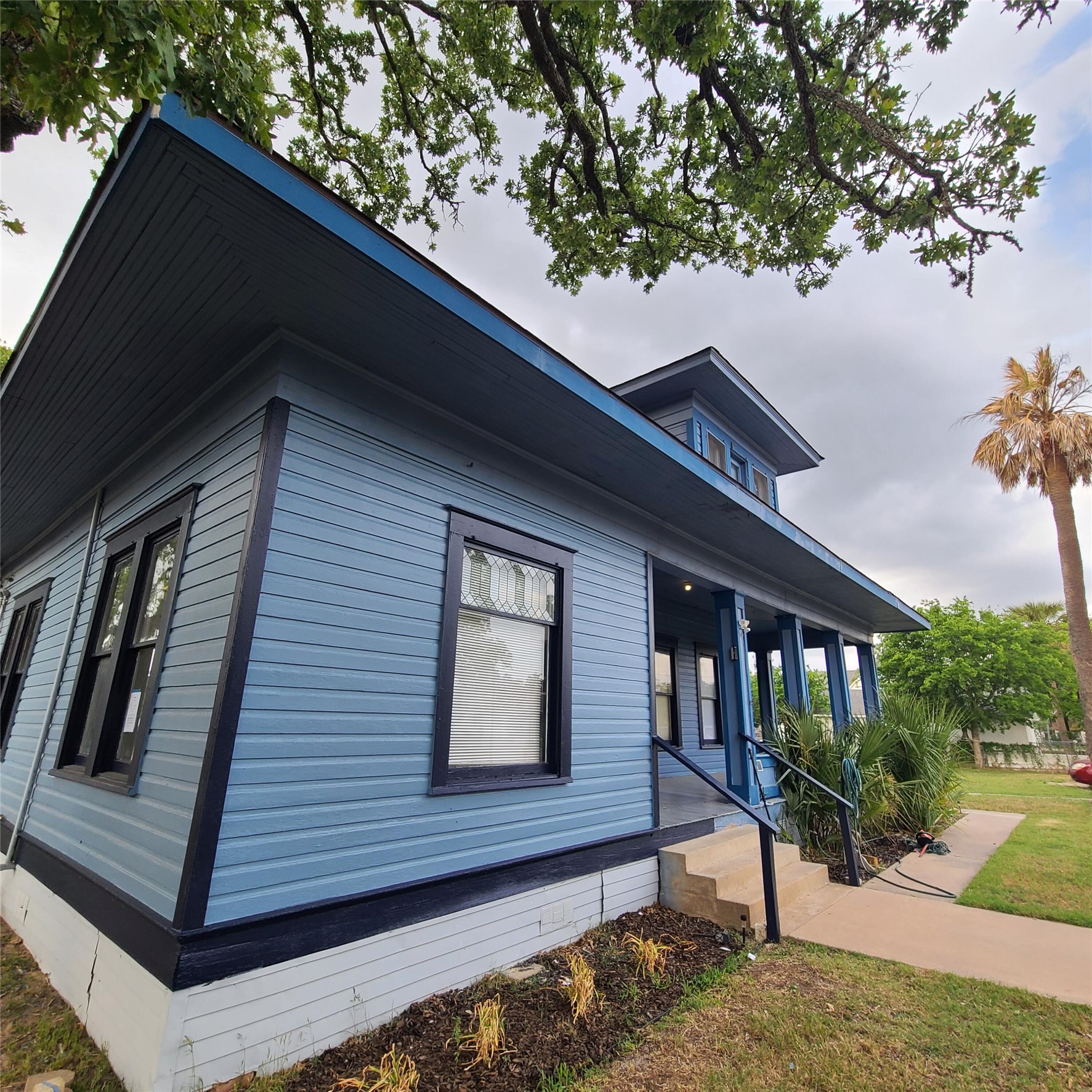 615 East Washington Street Giddings, TX 78942 - Photo 7 of 22 a view of house with a window and wooden fence