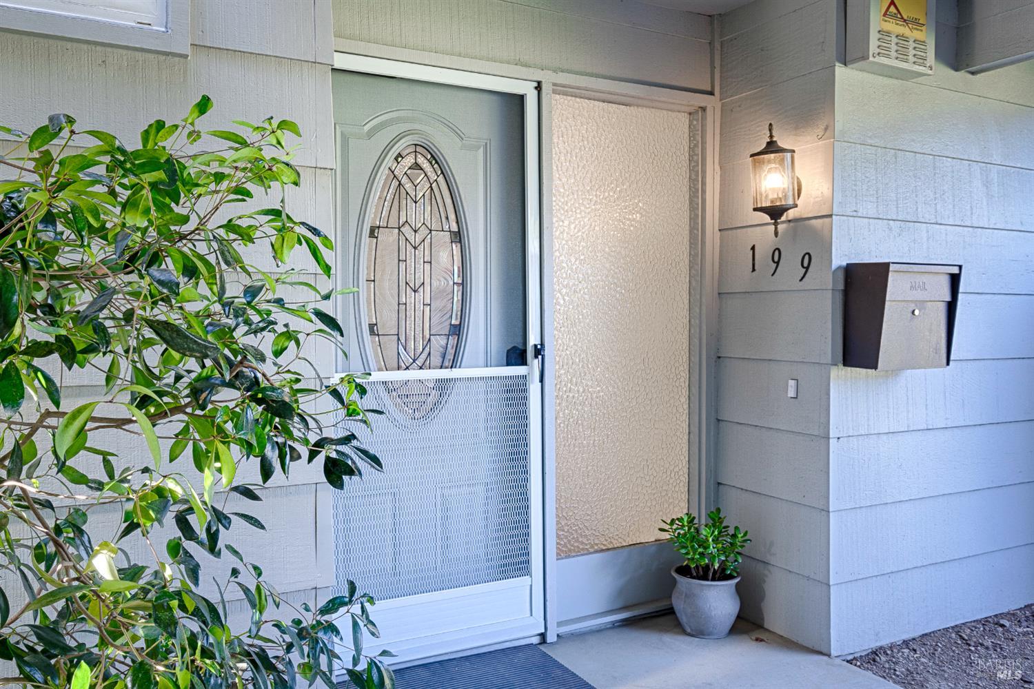 199 White Oak Drive Santa Rosa, CA 95409 - Photo 2 of 37 a potted plant sitting in front of a door