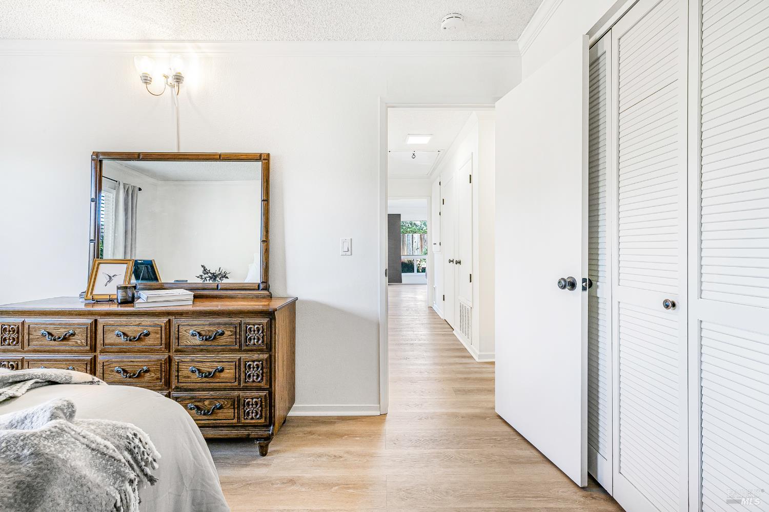 199 White Oak Drive Santa Rosa, CA 95409 - Photo 22 of 37 a bedroom with a bed and a mirror