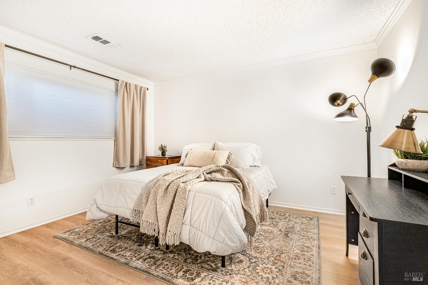 199 White Oak Drive Santa Rosa, CA 95409 - Photo 23 of 37 a bed sitting in a bedroom next to a window