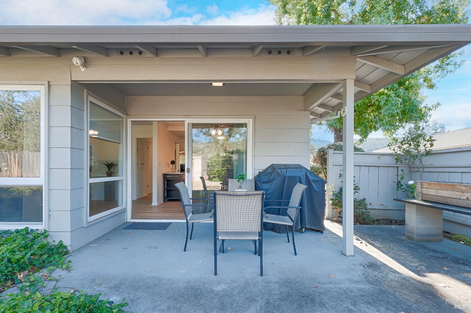 199 White Oak Drive Santa Rosa, CA 95409 - Photo 28 of 37 a view of a patio with table and chairs and a barbeque