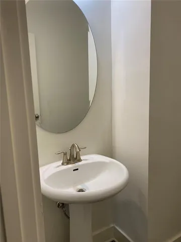a bathroom with a sink and mirror