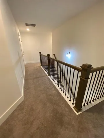 a view of a hallway with staircase