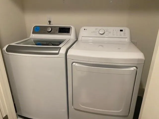 a utility room with dryer and washer