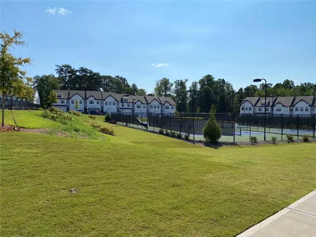 a swimming pool that has lawn chairs in the ocean