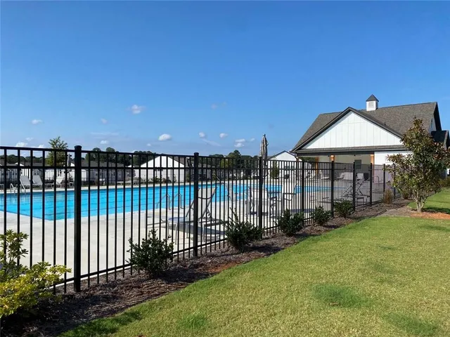 a view of a backyard with plants and a garden