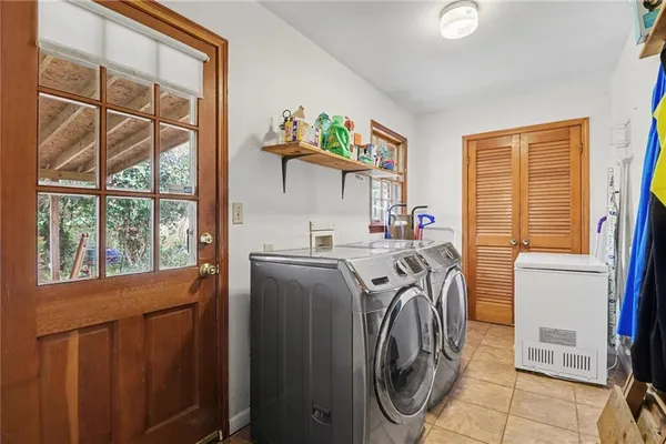 a utility room with dryer and washer