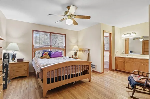 a bedroom with a bed and a table in it