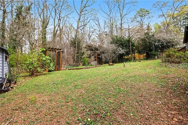 a backyard of a house with lots of green space