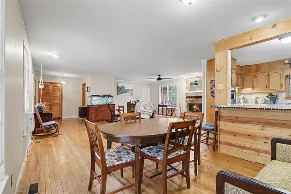 a view of a dining room with furniture and a floor to ceiling window