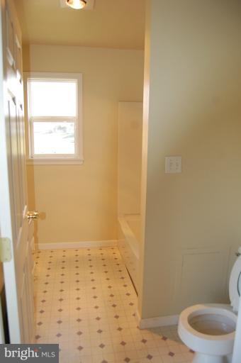 10514 Liberty Road Frederick, MD 21701 - Photo 11 of 17 a bathroom with a toilet and a shower
