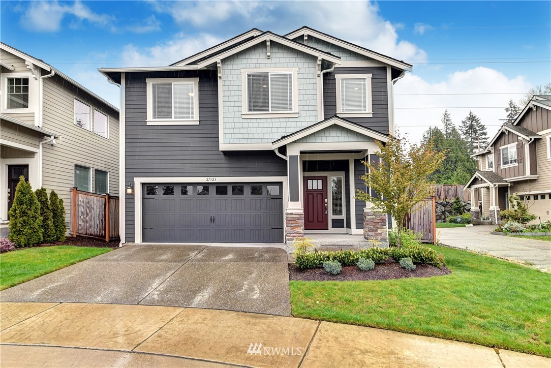21323 42nd Avenue Southeast Bothell, WA 98021 - Photo 1 of 16 a front view of a house with a garden and plants
