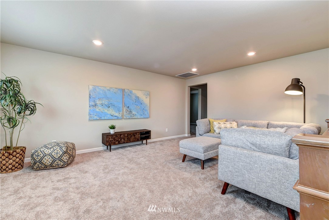 21323 42nd Avenue Southeast Bothell, WA 98021 - Photo 11 of 16 a living room with furniture and a potted plant