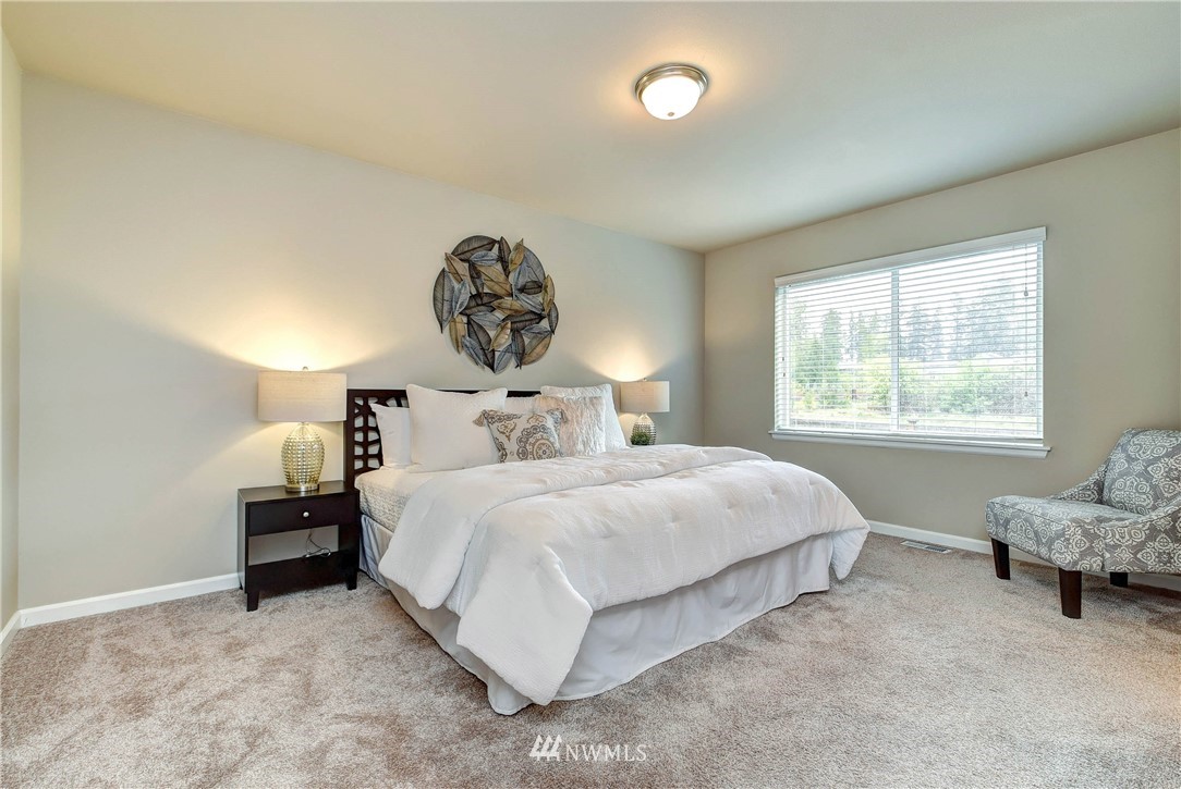 21323 42nd Avenue Southeast Bothell, WA 98021 - Photo 12 of 16 a bedroom with a bed and a window