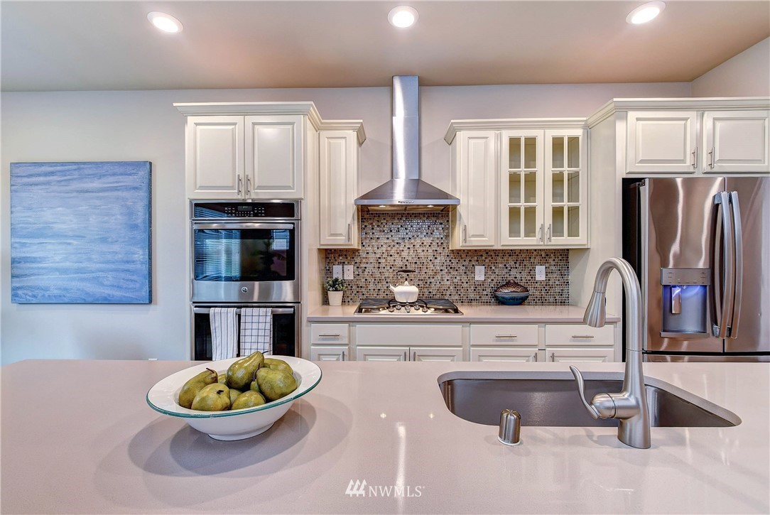 21323 42nd Avenue Southeast Bothell, WA 98021 - Photo 3 of 16 a kitchen with a sink and a stove top oven