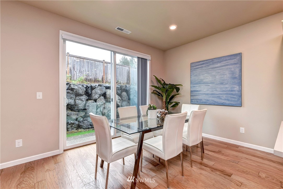 21323 42nd Avenue Southeast Bothell, WA 98021 - Photo 4 of 16 a dining room with furniture and wooden floor