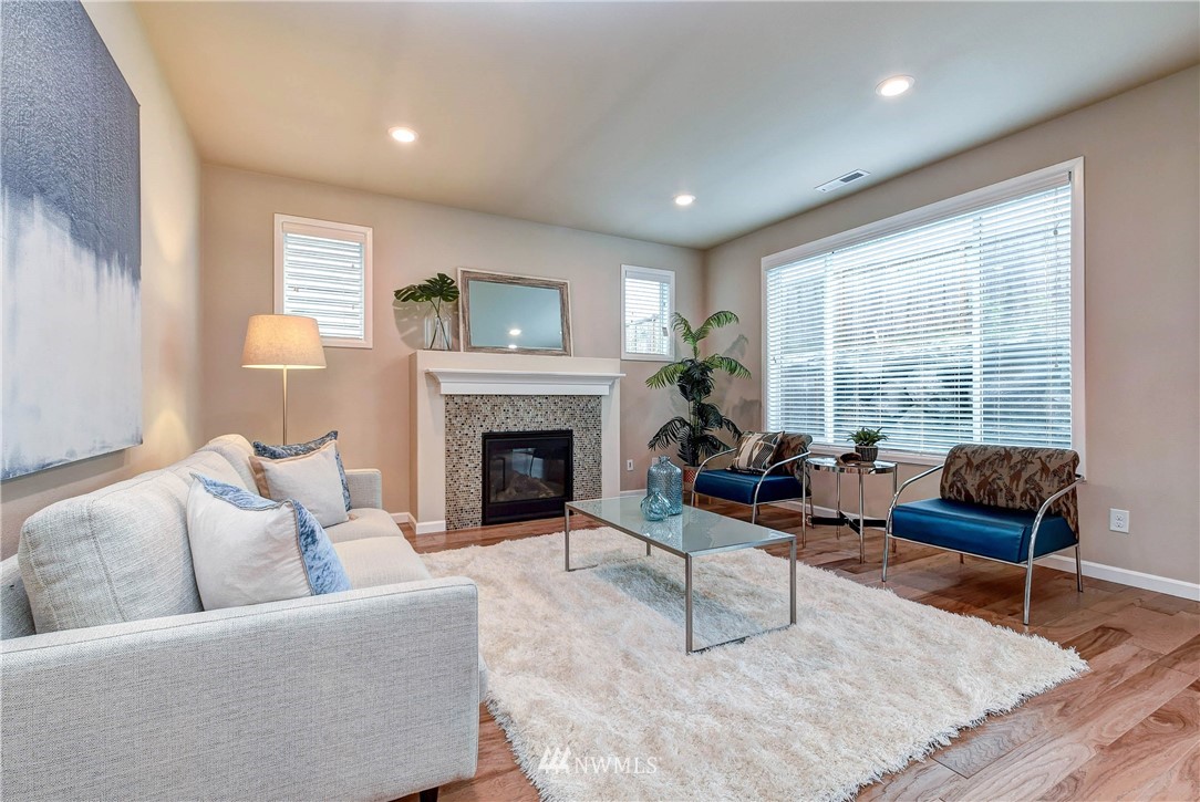 21323 42nd Avenue Southeast Bothell, WA 98021 - Photo 5 of 16 a living room with furniture and a fireplace