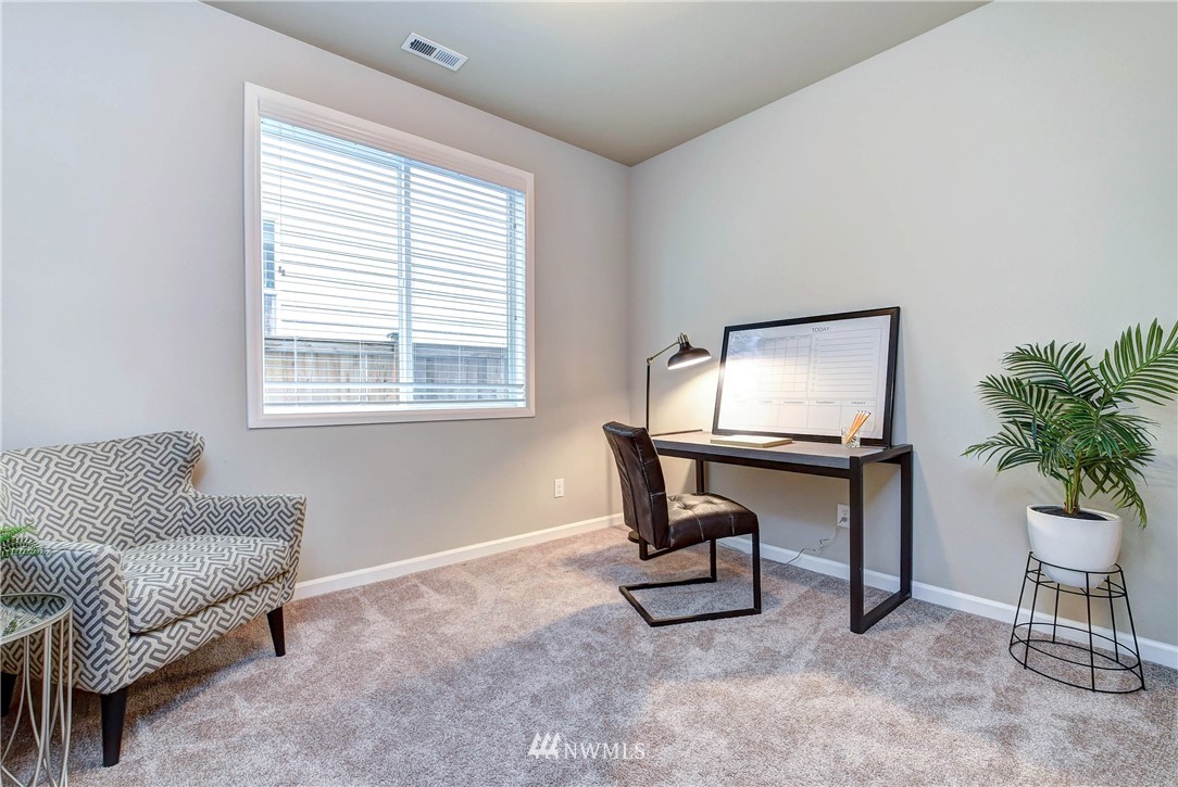21323 42nd Avenue Southeast Bothell, WA 98021 - Photo 7 of 16 a living room with furniture and a window