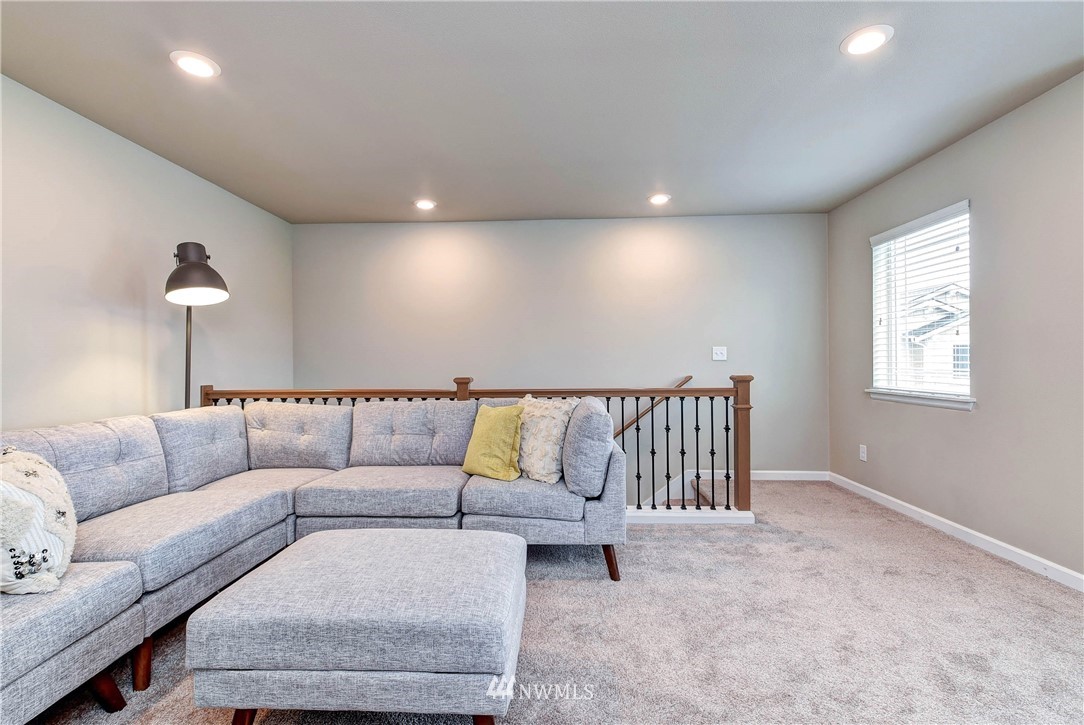 21323 42nd Avenue Southeast Bothell, WA 98021 - Photo 10 of 16 a living room with furniture and a couch